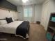 Cozy bedroom featuring neutral tones, carpet, white bedding, and ample natural light at 3370 S Ivy Way, Chandler, AZ 85248