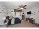 Bright bedroom featuring a ceiling fan, blue accents, and natural light from the window at 3370 S Ivy Way, Chandler, AZ 85248