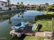 Dock equipped with a boat and surfboards, ideal for water activities and enjoying waterfront living at 3370 S Ivy Way, Chandler, AZ 85248