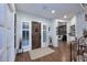 Inviting foyer with hardwood floors, a wooden door, and views of the living room and staircase at 3370 S Ivy Way, Chandler, AZ 85248