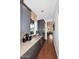 Kitchen features gray cabinets, granite countertops, stainless steel wine cooler and wood flooring at 3370 S Ivy Way, Chandler, AZ 85248