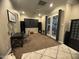 Open living space with neutral walls, dark furniture, and sliding glass doors at 3370 S Ivy Way, Chandler, AZ 85248