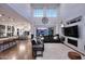 Spacious living room featuring high ceilings, large windows, and seamless flow into the kitchen and dining area at 3370 S Ivy Way, Chandler, AZ 85248