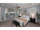 Main bedroom features stylish decor, large windows, and a comfortable king-size bed at 3370 S Ivy Way, Chandler, AZ 85248