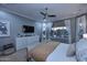 Well-lit main bedroom boasts calming colors, large windows, and a comfortable king-size bed at 3370 S Ivy Way, Chandler, AZ 85248