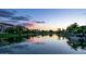 Tranquil waterfront scenery reflecting the beautiful sunset colors, creating a serene and picturesque view at 3370 S Ivy Way, Chandler, AZ 85248