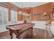 Bright and airy game room featuring a pool table, plantation shutters, and classic decor at 346 W Alamosa Dr, Chandler, AZ 85248