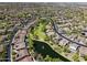 Extensive aerial view showcases a vast community with green spaces, a pond, and well-maintained streets at 3654 E San Pedro Pl, Chandler, AZ 85249