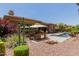 Private backyard oasis with pool, spa, outdoor kitchen, and mature landscaping at 3654 E San Pedro Pl, Chandler, AZ 85249