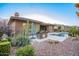 Spacious backyard with pool, spa, built-in grill, and drought-tolerant landscaping at 3654 E San Pedro Pl, Chandler, AZ 85249