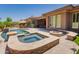 Backyard featuring pool, spa, outdoor kitchen, firepit, and manicured landscaping at 3654 E San Pedro Pl, Chandler, AZ 85249