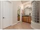 Bathroom with dual vanities, a glass block accent, and a separate toilet room at 3654 E San Pedro Pl, Chandler, AZ 85249