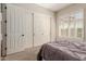 Serene bedroom includes large closet doors, a shuttered window, and neutral tones for a relaxing atmosphere at 3654 E San Pedro Pl, Chandler, AZ 85249