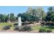 Beautiful landscaping and fountain in community with mature trees and manicured lawns at 3654 E San Pedro Pl, Chandler, AZ 85249