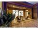 Relaxing covered patio featuring comfortable seating, ceiling fan, and seamless transition to indoor living space at 3654 E San Pedro Pl, Chandler, AZ 85249