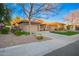 Well-maintained single-story home with desert landscaping, lawn, and a three-car garage at 3654 E San Pedro Pl, Chandler, AZ 85249