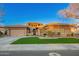 Beautiful single-story home with manicured lawn, stone accents, and a three-car garage at 3654 E San Pedro Pl, Chandler, AZ 85249