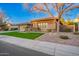 Lovely single-story home with desert landscaping, lawn, and a two-car garage at 3654 E San Pedro Pl, Chandler, AZ 85249