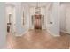 Grand foyer with arched niches, decorative lighting, and a glimpse into a conveniently located powder room at 3654 E San Pedro Pl, Chandler, AZ 85249