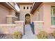 Charming front entrance with stone accents, a walkway, and a wreath on the front door at 3654 E San Pedro Pl, Chandler, AZ 85249