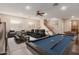 Spacious game room featuring a pool table, theater seating, and a cozy atmosphere at 3654 E San Pedro Pl, Chandler, AZ 85249