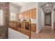 Upstairs hallway with built-in cabinets and stone wall feature leading to additional rooms in the house at 3654 E San Pedro Pl, Chandler, AZ 85249
