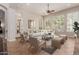 Bright living room with large windows, plantation shutters, neutral decor, and an open layout at 3654 E San Pedro Pl, Chandler, AZ 85249