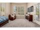 Main bedroom showcases plenty of natural light, plantation shutters, and a cozy sitting area at 3654 E San Pedro Pl, Chandler, AZ 85249
