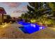 Inviting backyard with pool, spa, fire pit, and lush greenery, perfect for outdoor entertaining at 3654 E San Pedro Pl, Chandler, AZ 85249