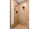 Beautiful tile shower with dual shower heads and glass block window at 3654 E San Pedro Pl, Chandler, AZ 85249