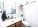 Stylish bathroom showcasing a modern vanity with matte black faucet and decorative woven shelf at 41250 W Thornberry Ln, Maricopa, AZ 85138
