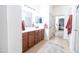 Bathroom with a large vanity, cabinet and walk in shower at 41250 W Thornberry Ln, Maricopa, AZ 85138