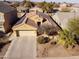 Charming home with a well-maintained front yard, two-car garage, and installed solar panels for energy efficiency at 41250 W Thornberry Ln, Maricopa, AZ 85138