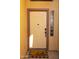 Inviting front door with smart lock, Ring doorbell, and 'hello' doormat at 41250 W Thornberry Ln, Maricopa, AZ 85138