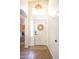 Inviting front entrance with a wreath, neutral colors, and natural light at 41250 W Thornberry Ln, Maricopa, AZ 85138