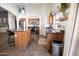 Open kitchen featuring an island with bar seating, stainless steel appliances, and stylish decor at 41250 W Thornberry Ln, Maricopa, AZ 85138