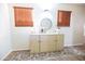 Living room area with a sideboard, mirror and modern decor at 41250 W Thornberry Ln, Maricopa, AZ 85138