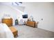Bright primary bedroom with ceiling fan, coordinated furniture, and tasteful decor at 41250 W Thornberry Ln, Maricopa, AZ 85138