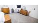 Bright main bedroom with a comfy chair and carpet at 41250 W Thornberry Ln, Maricopa, AZ 85138