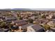Expansive aerial view of a sprawling suburban neighborhood featuring diverse homes, lush trees, and well-maintained streets at 41250 W Thornberry Ln, Maricopa, AZ 85138