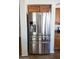 Close up of the stainless steel, four-door refrigerator in the kitchen at 41250 W Thornberry Ln, Maricopa, AZ 85138