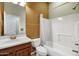 Bathroom featuring a single vanity sink, bathtub and shower combination with neutral colors and tile floors at 42988 W Misty Morning Ln, Maricopa, AZ 85138