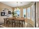 This dining room features an elegant chandelier and a wall mural at 42988 W Misty Morning Ln, Maricopa, AZ 85138
