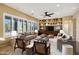 This living room is bright and airy, featuring stylish sofas and shelving at 42988 W Misty Morning Ln, Maricopa, AZ 85138