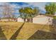 Large backyard showcasing the home's exterior, patio area, and lush greenery, a perfect outdoor space at 430 N Vineyard --, Mesa, AZ 85201