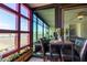 Enclosed balcony offering city views, seating, and a planter box provides an inviting outdoor living space at 4808 N 24Th St # 1402, Phoenix, AZ 85016