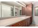 Bathroom vanity with a large mirror, recessed lights, and wooden cabinets with plenty of storage at 4808 N 24Th St # 1402, Phoenix, AZ 85016