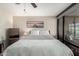 Serene bedroom with tranquil decor, soft lighting, and a picturesque view of the outside at 4808 N 24Th St # 1402, Phoenix, AZ 85016