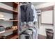 Organized walk-in closet with built-in shelves and hanging racks, offering ample storage space at 4808 N 24Th St # 1402, Phoenix, AZ 85016