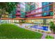 Beautiful courtyard with a fountain, lawn, and seating amidst modern architecture at 4808 N 24Th St # 1402, Phoenix, AZ 85016